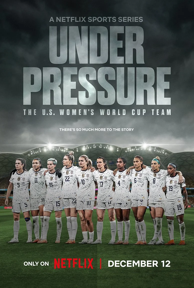 Poster for the Netflix sports series "Under Pressure: The U.S. Women's World Cup Team" featuring the team standing arm in arm on a soccer field, with a stadium in the background, promoting the show available on December 12.