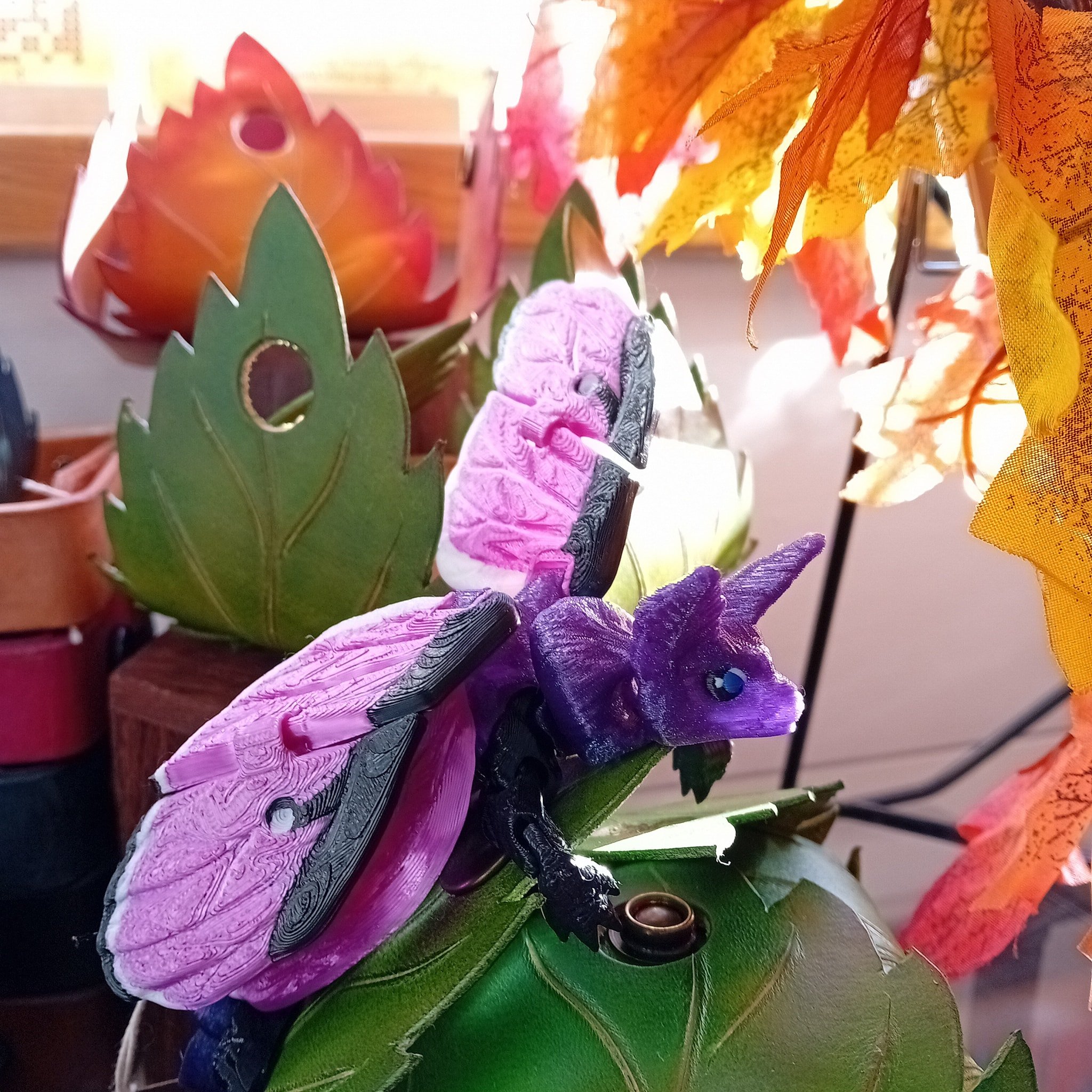 If you sneak in quietly in the morning you might see a Lunar Moth dragon improbably basking in a sunbeam 🌞, a Sheffield peregrine surveying their domain 🦅 🏛, a former parrot admiring themselves in jewellery 💎🪞 and a Cobra lurking in a box after 