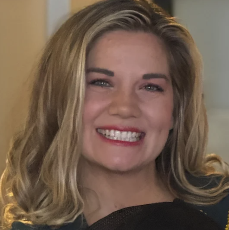 Birt Beirer Second helping Avenue A Films A woman with blonde hair smiling broadly showing her teeth.