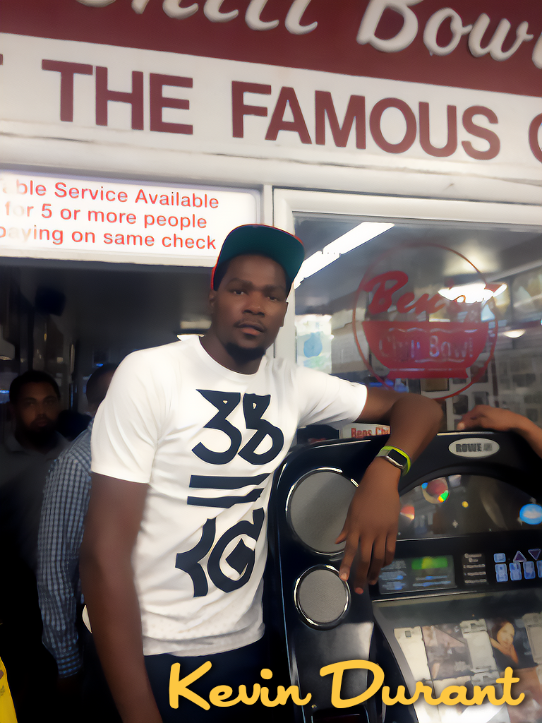 A man standing next to a jukebox in a restaurant or fast-food place with a sign behind him reading "The Famous" and part of another sign stating "Available Service Available for 5 or more people." The man has a serious expression, wearing a white T-s