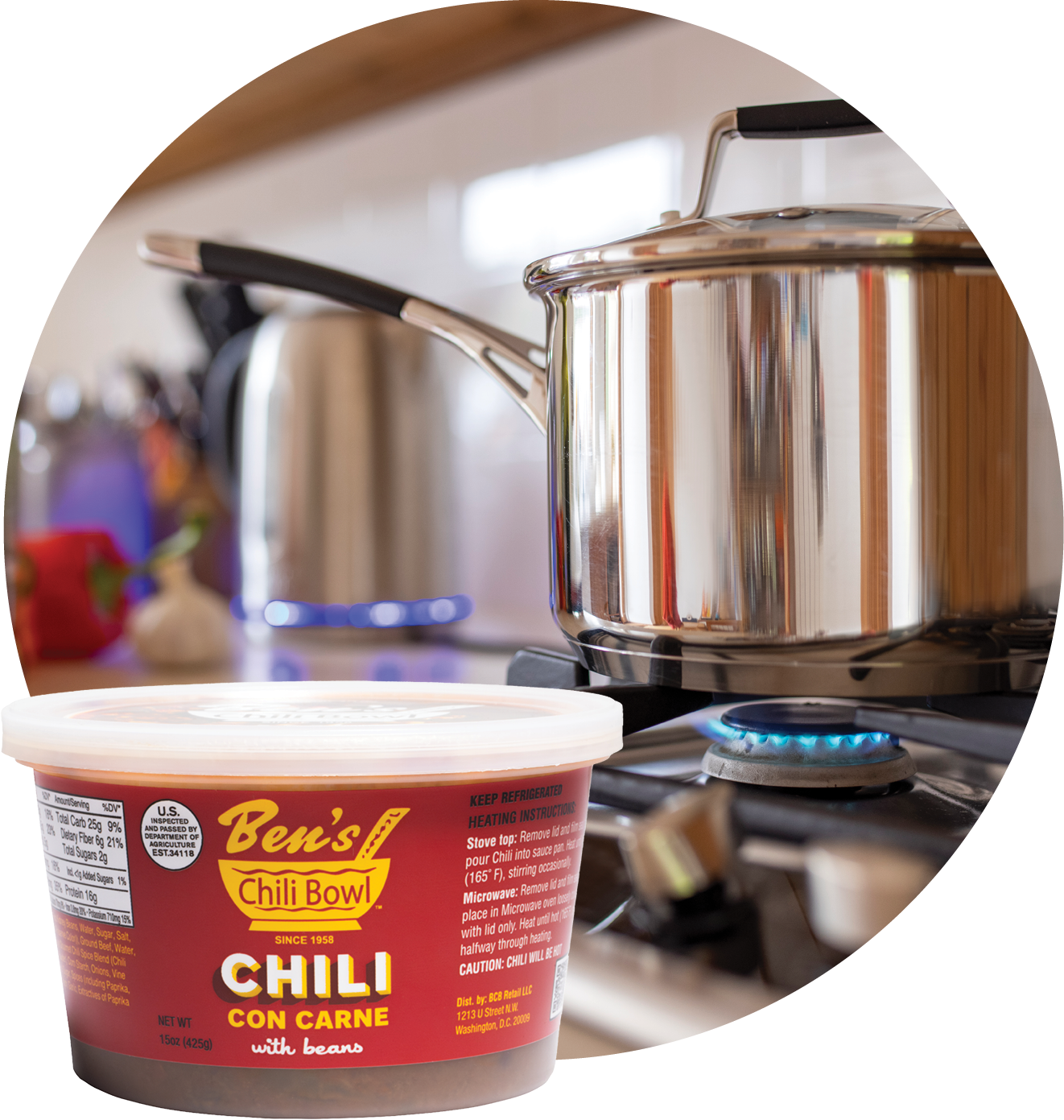 A container of Ben's Chili Bowl chili with beans placed on a kitchen stove next to a stainless steel teapot and a stainless steel pot on the burner.