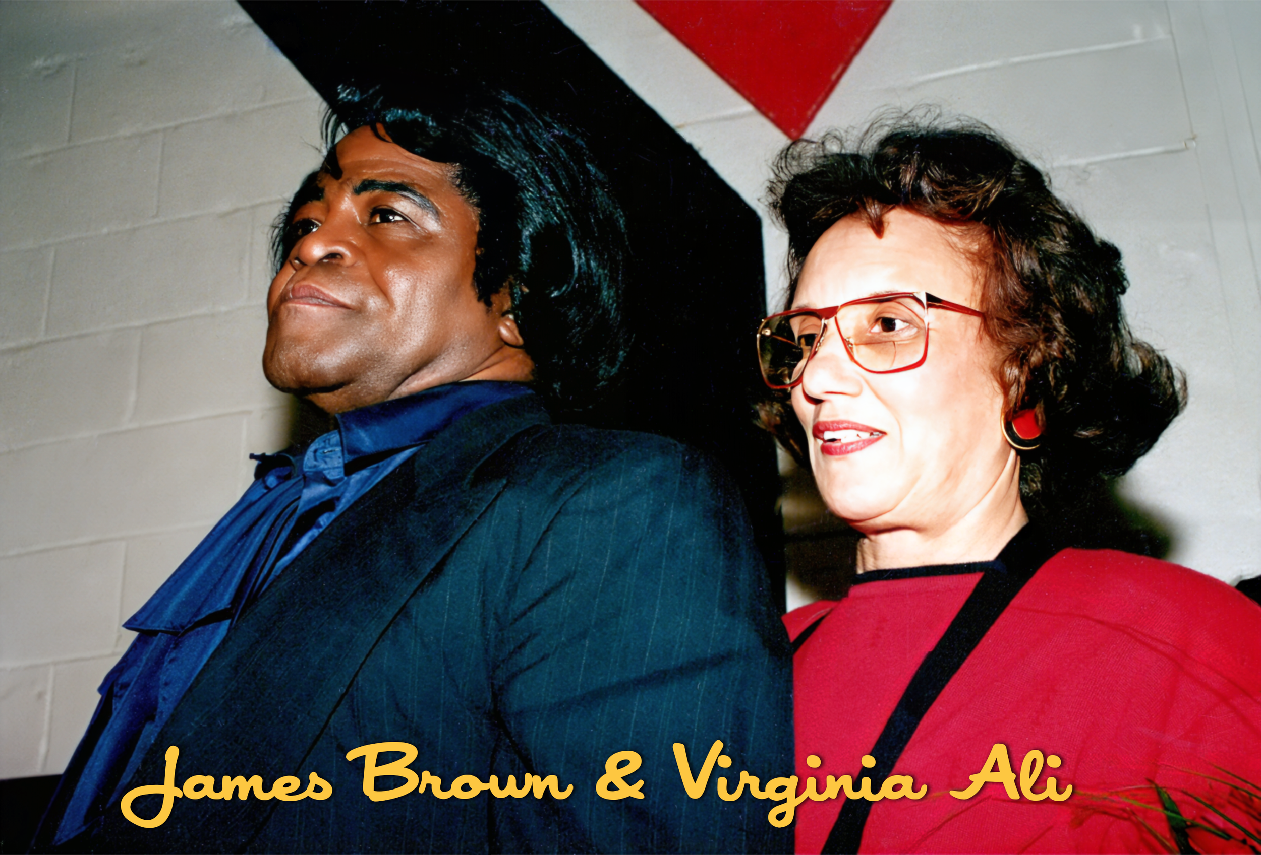 A man with dark hair and a woman with curly hair and glasses standing close together, with the woman smiling. Text overlay: James Brown & Virginia Ali.