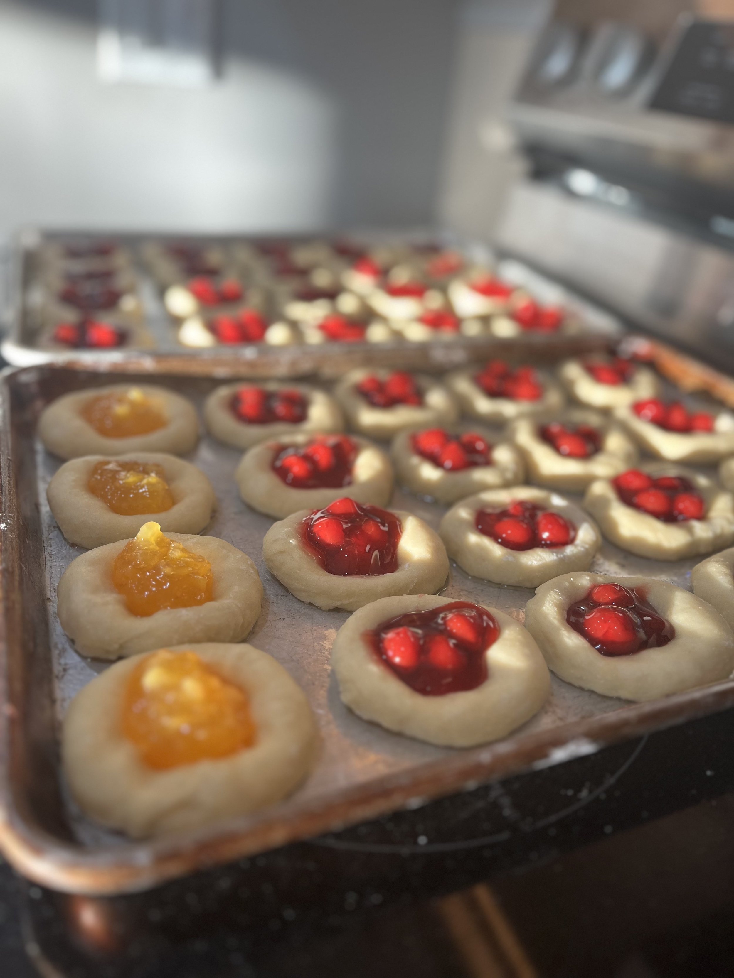 Tray of kolaches with apricot and cherry toppings from Sixth Street Kolaches in Nebraska.