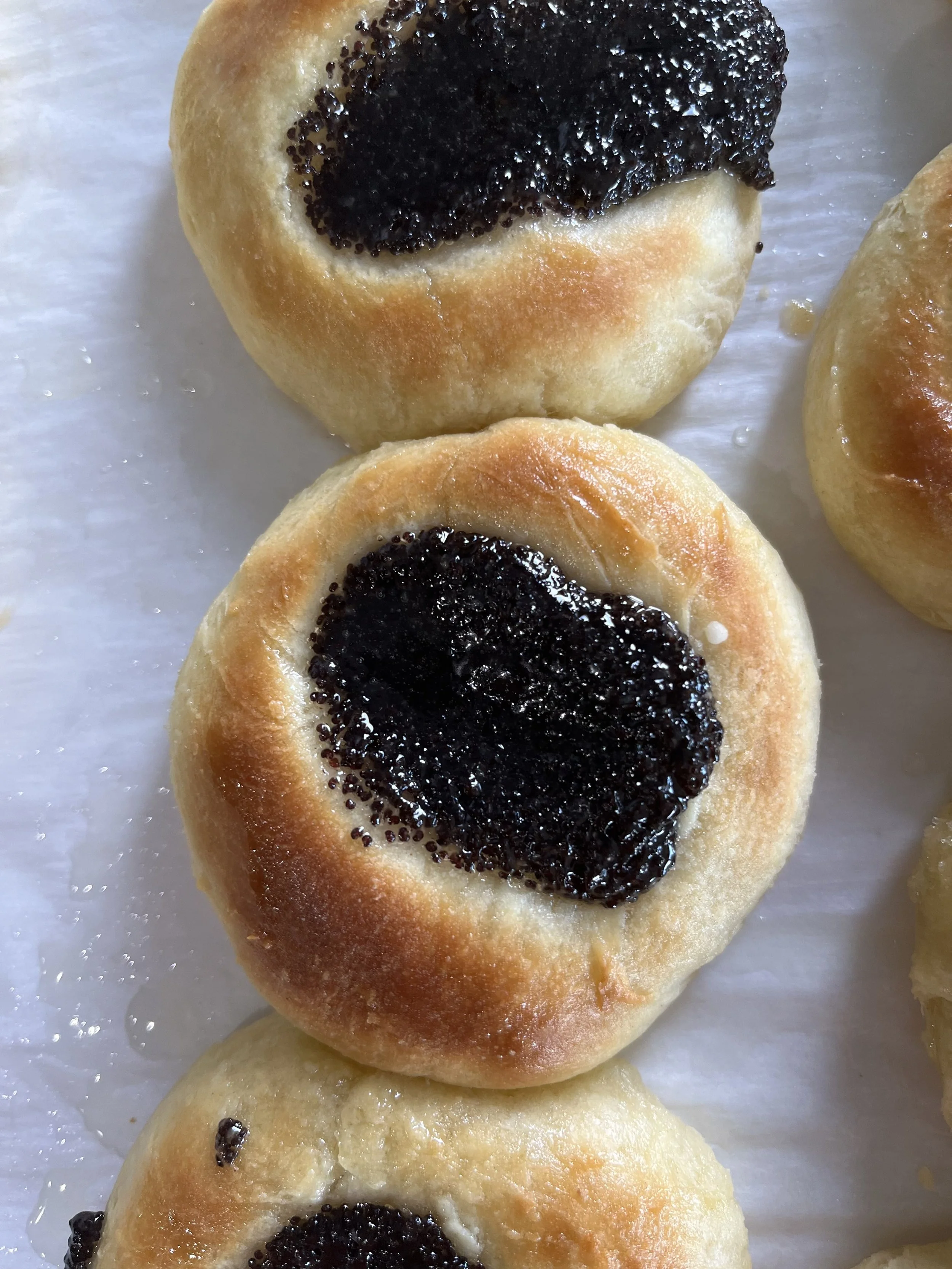 Close-up of three poppyseed kolaches from Sixth Street Kolaches in Nebraska.