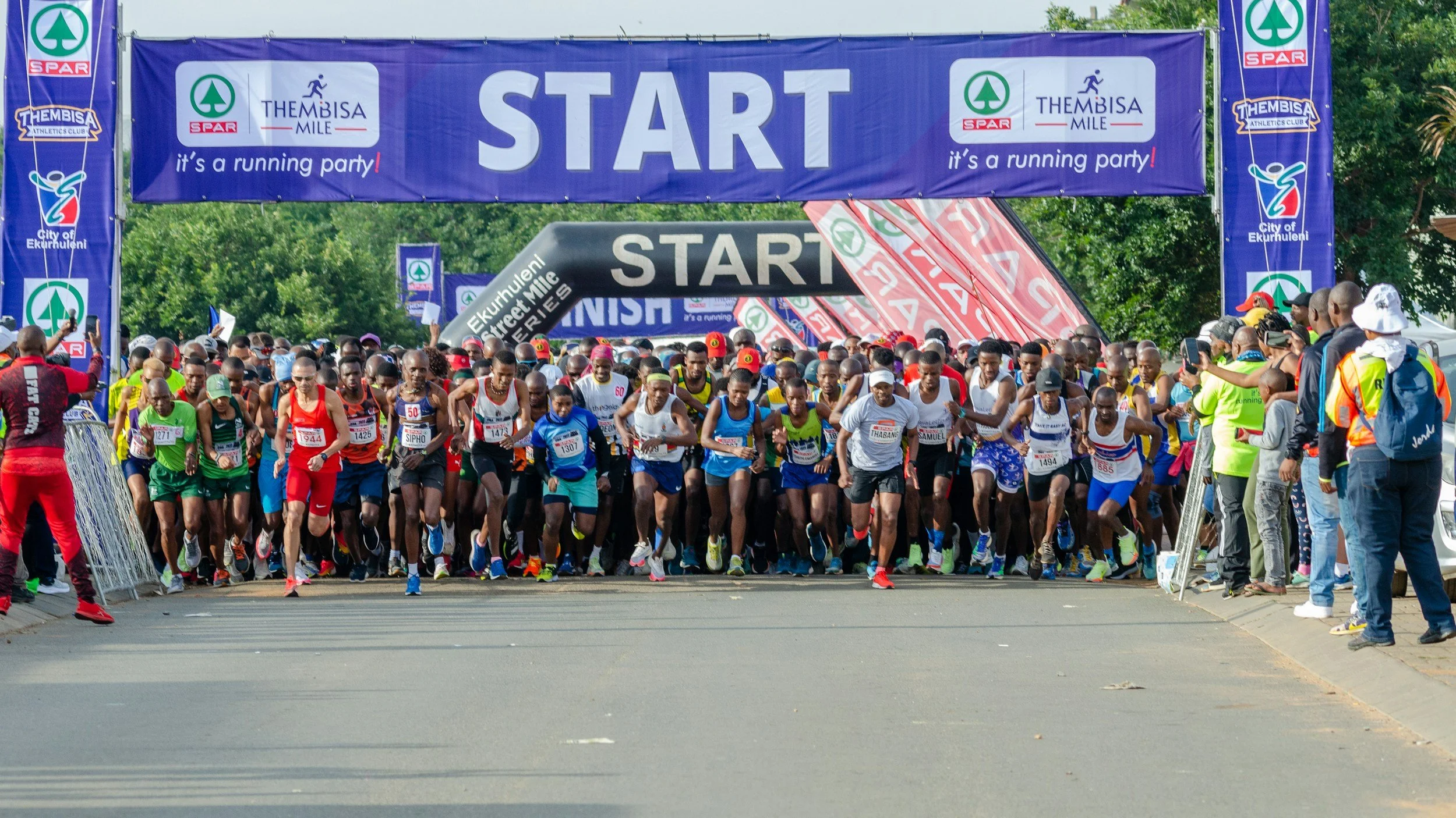 Runners beginning a marathon at the start line, symbolizing the courage to start even when you feel behind