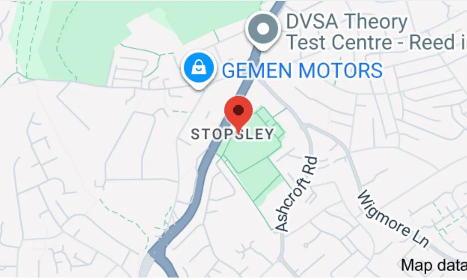 Map showing a location marked as 'STOP SLEY' near Ashcroft Road and Wigmore Lane, with nearby businesses including Gemen Motors and DVSA Theory Test Centre.