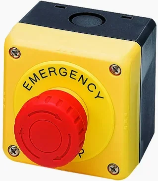 Botón de emergencia amarillo con interruptor rojo, usado para detener maquinaria en caso de emergencia.
