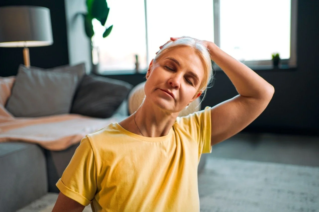 Person doing gentle neck stretch