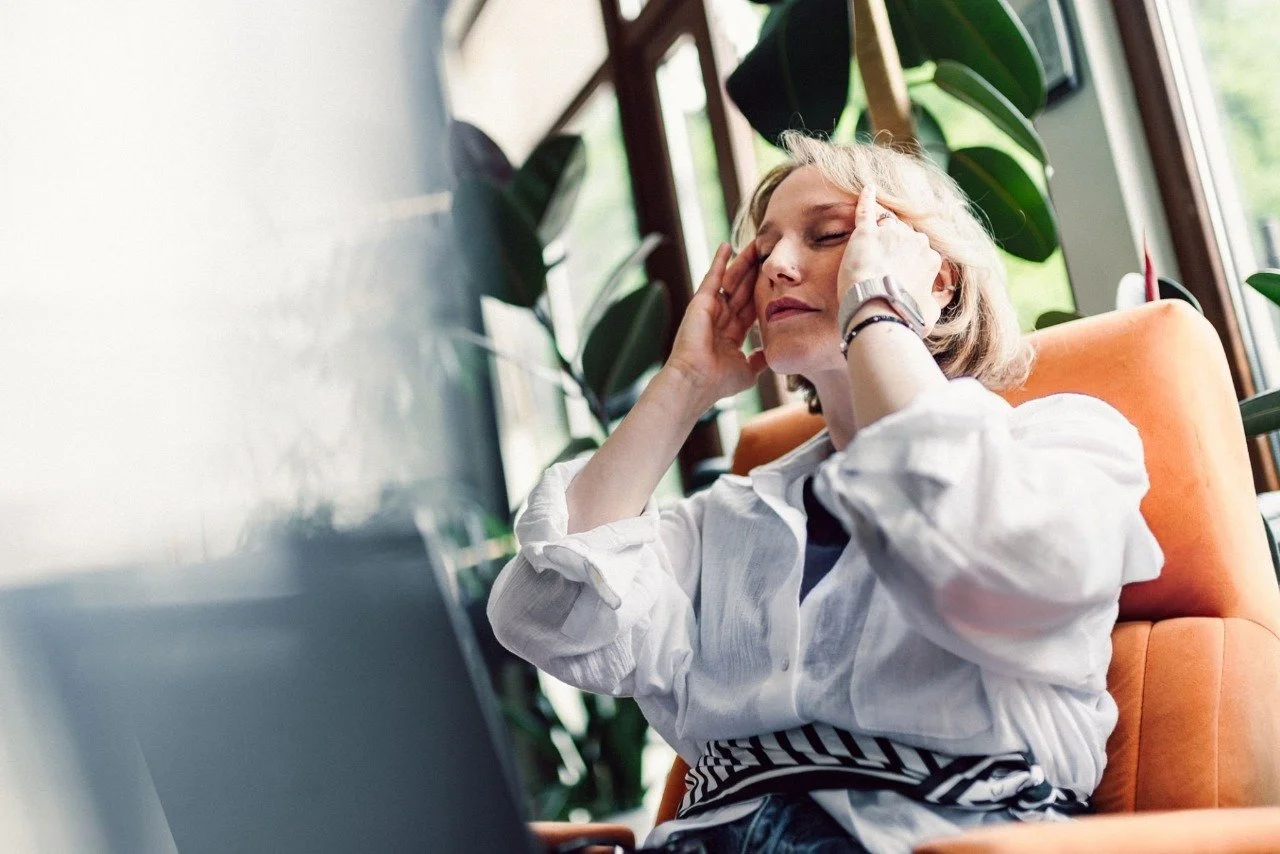 Stressed Office Woman Rubbing Temples