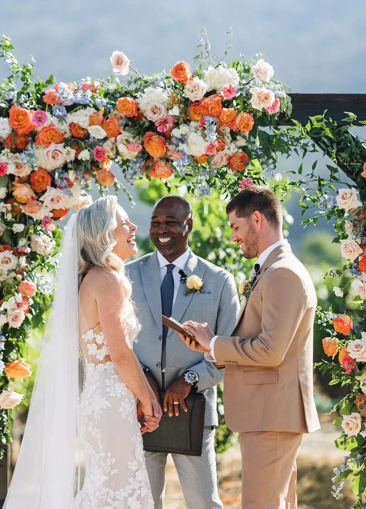 The Blonde Bouquet Floral Design - Northern California. Florist for Napa, Lake Tahoe, San Francisco, Sonoma weddings. Bright, elegant flower arch & bouquet. Garden roses, peonies, smilax.