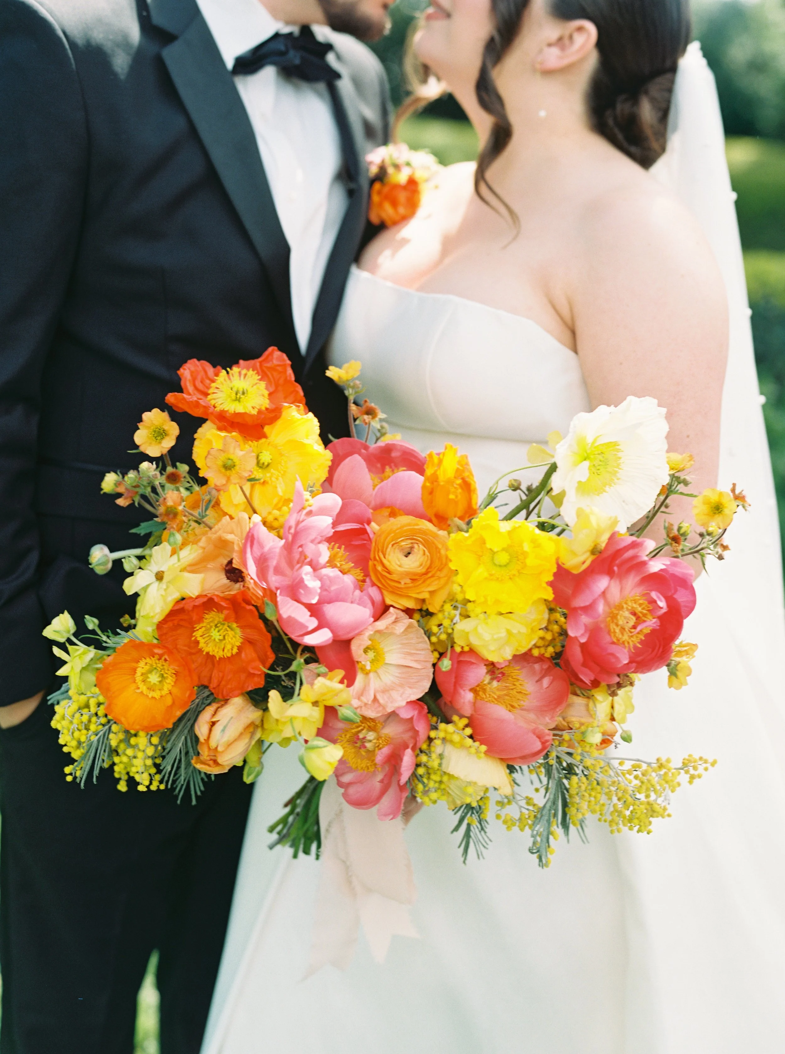 The Blonde Bouquet Floral Design - Northern California. Florist for Napa, Lake Tahoe, San Francisco, Sonoma weddings. Bright, colorful flowers, ranunculus, peonies, Iceland poppy, tulips, acacia bloom, anemones in yellow, orange, pink, red