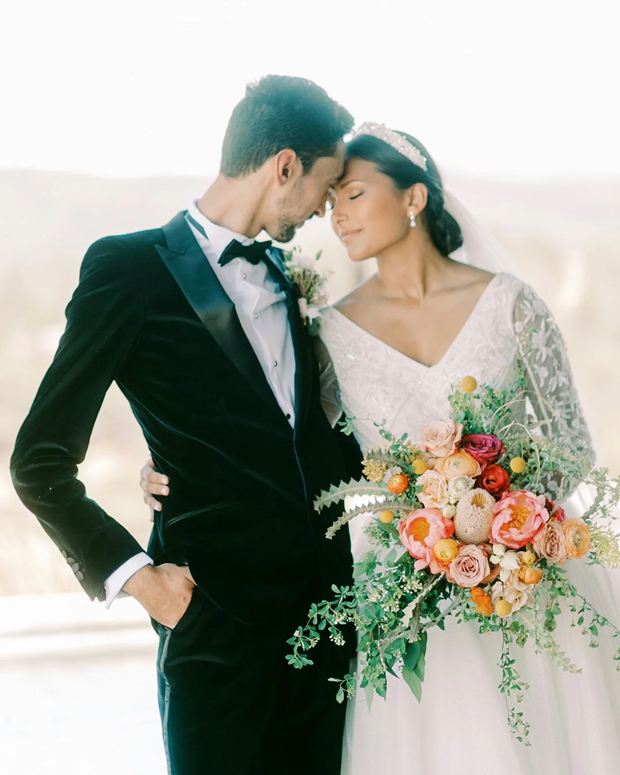 The Blonde Bouquet Floral Design - Northern California. Florist for Napa, Lake Tahoe, San Francisco, Sonoma weddings. Elegant, colorful, organic, whimsical, cascading bouquet with banksia, peonies, ranunculus, billy balls, seeded eucalyptus