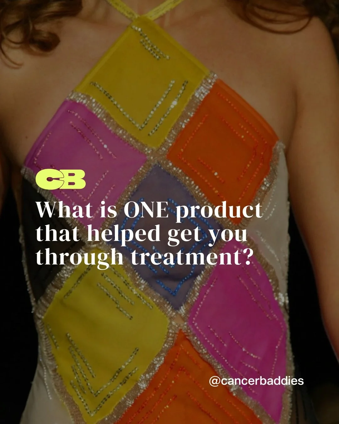 Colorful dress with square patterns in yellow, pink, orange, purple, and black, decorated with silver beads and sequins, worn by a person.