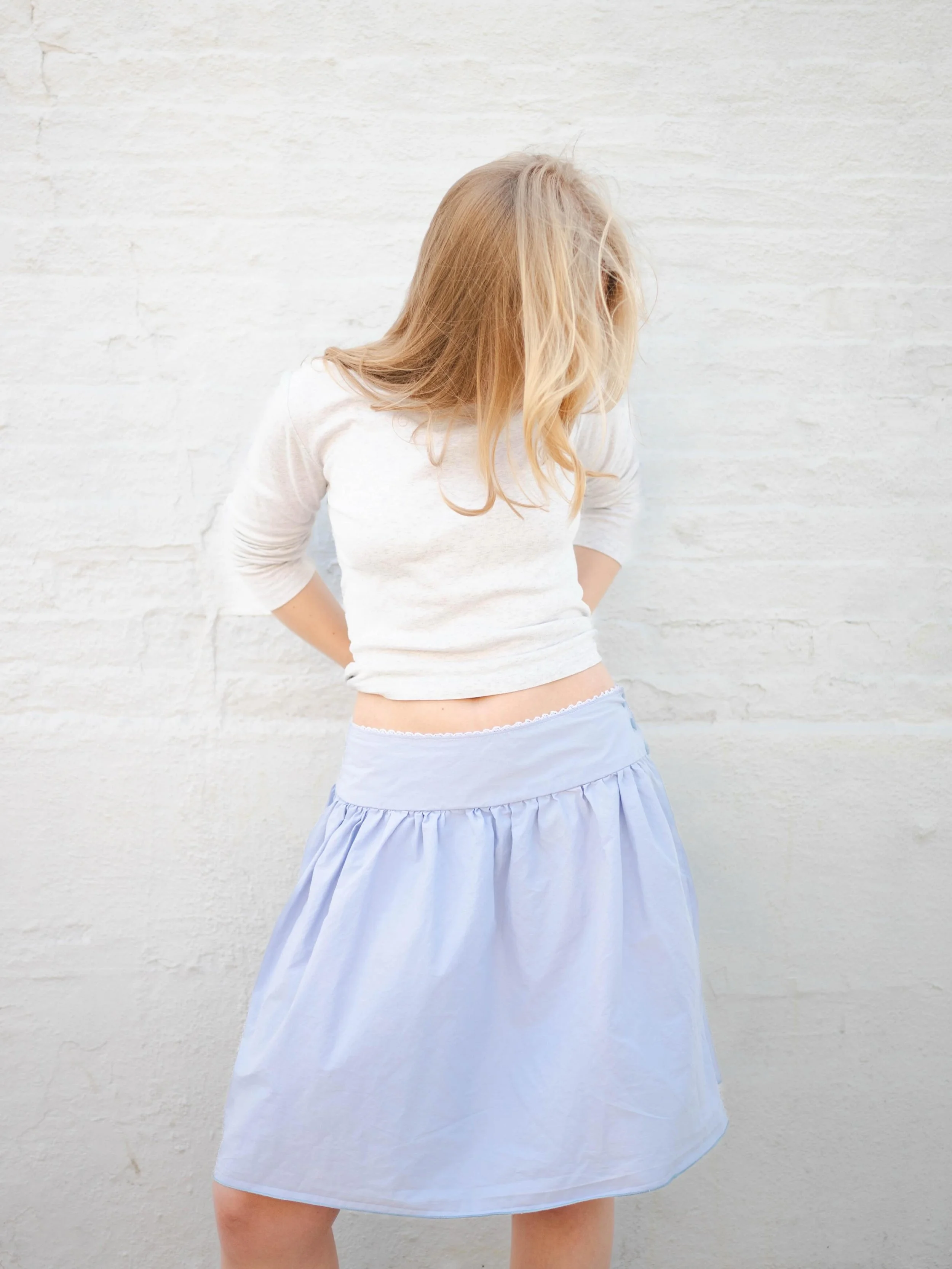 Introducing the Sunday Morning Skirt!

The Sunday Morning Skirt is a midi length skirt featuring a button closure. The gathered nature of the skirt creates an A-Line silhouette, which is perfect for any occasion. 

Models are wearing a size S

Made t