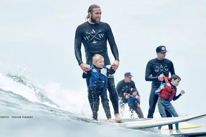 A walk On Water Surf Therapy. Date: TBD Summer 2026. Volunteers will aid in beach or water safety.