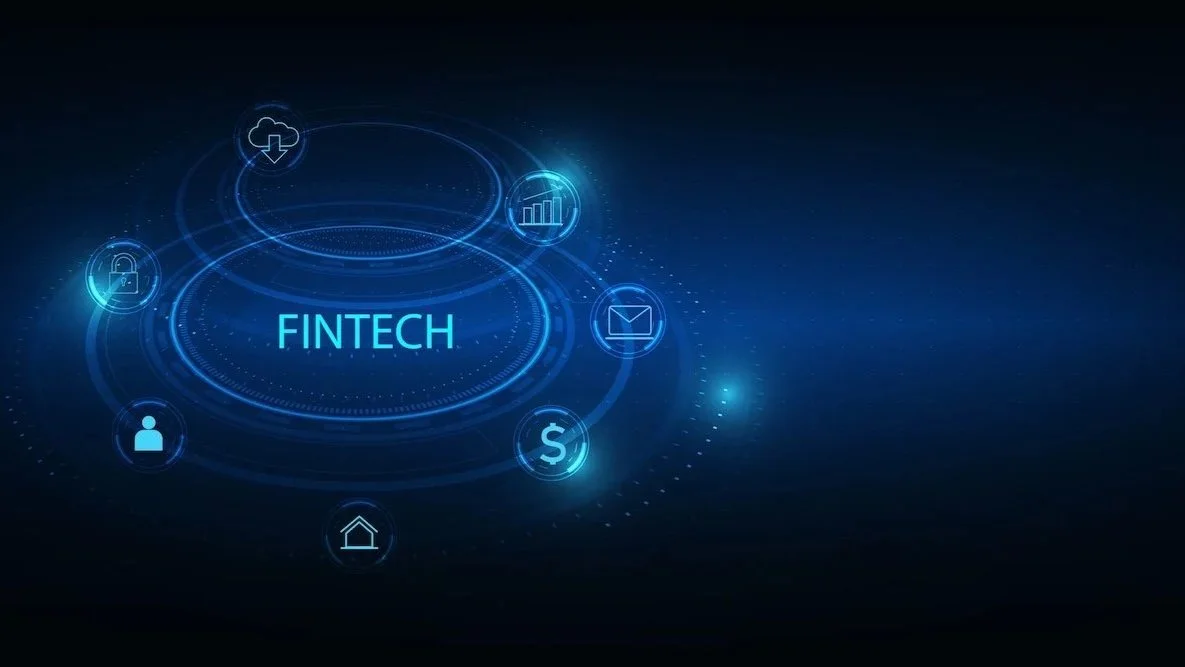 Digital graphic representing fintech, with icons of lock, user, house, dollar sign, email, bar chart, and cloud download surrounding the word 'Fintech' in the center.