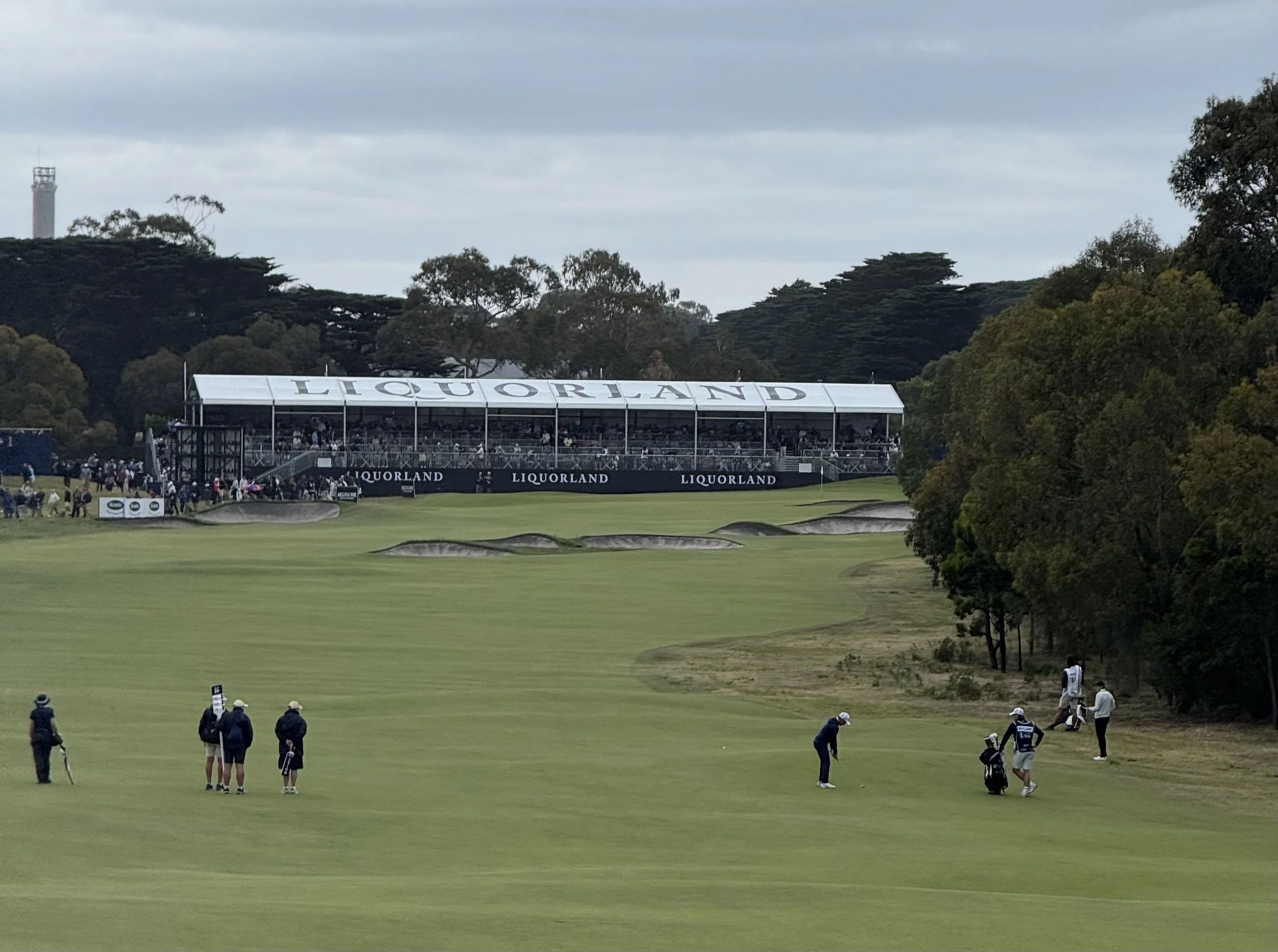 Liquorland branding dominates the 17th grandstand at Royal Melbourne, delivering prime visibility on-course and on TV.