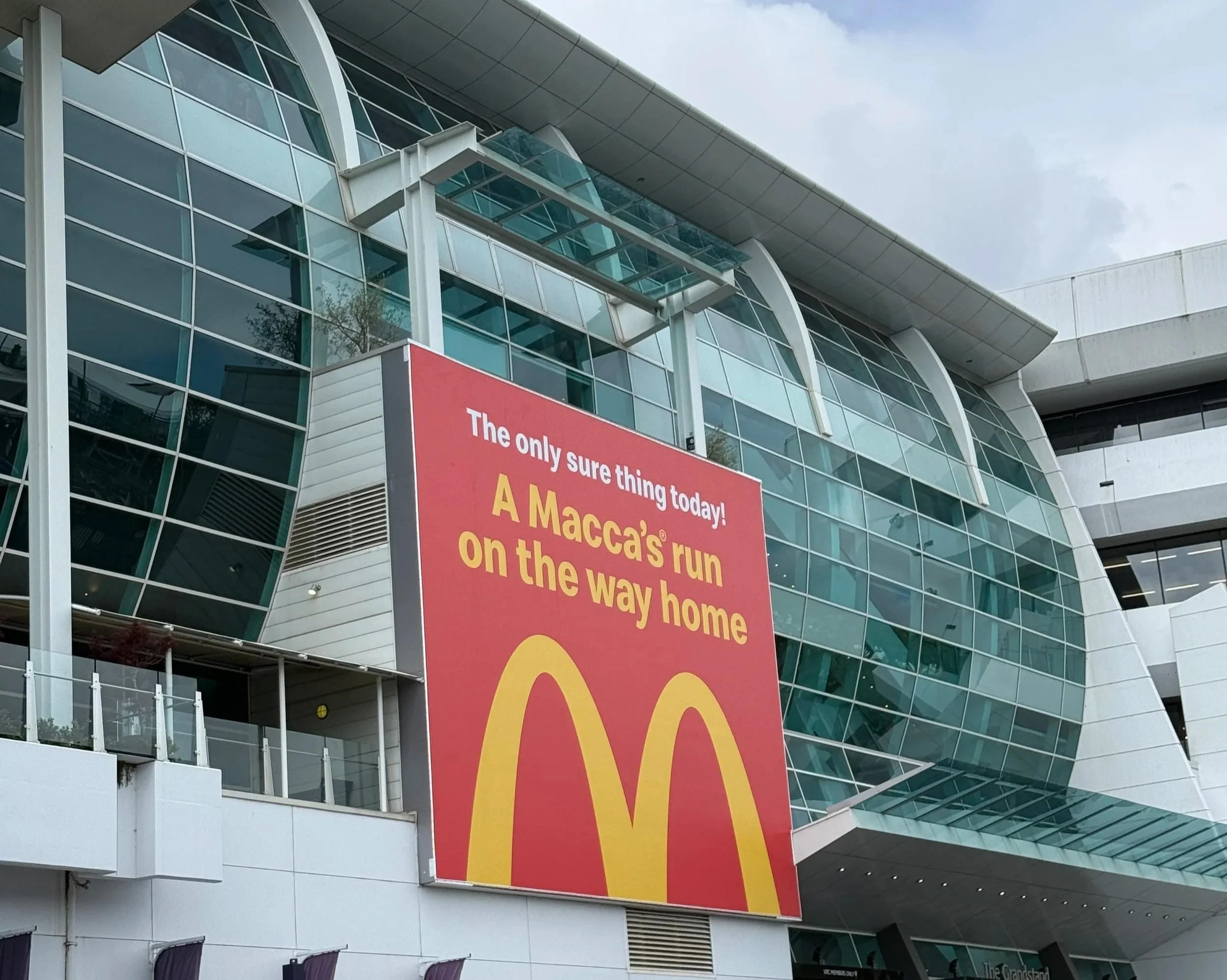  McDonald’s poster near Flemington station capturing race-day humour and brand timing. 