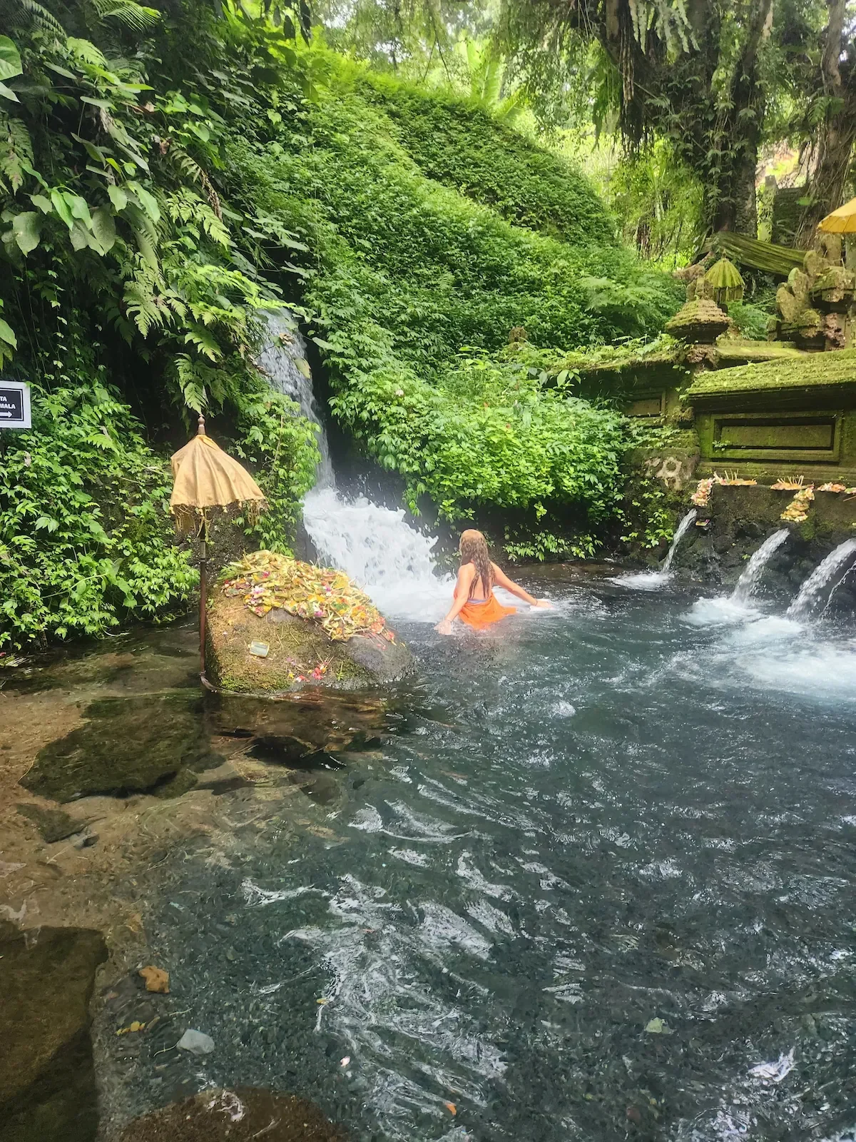 Jaya Hollohan, somatic healing retreat guide, at a sacred Balinese site in Ubud, Bali