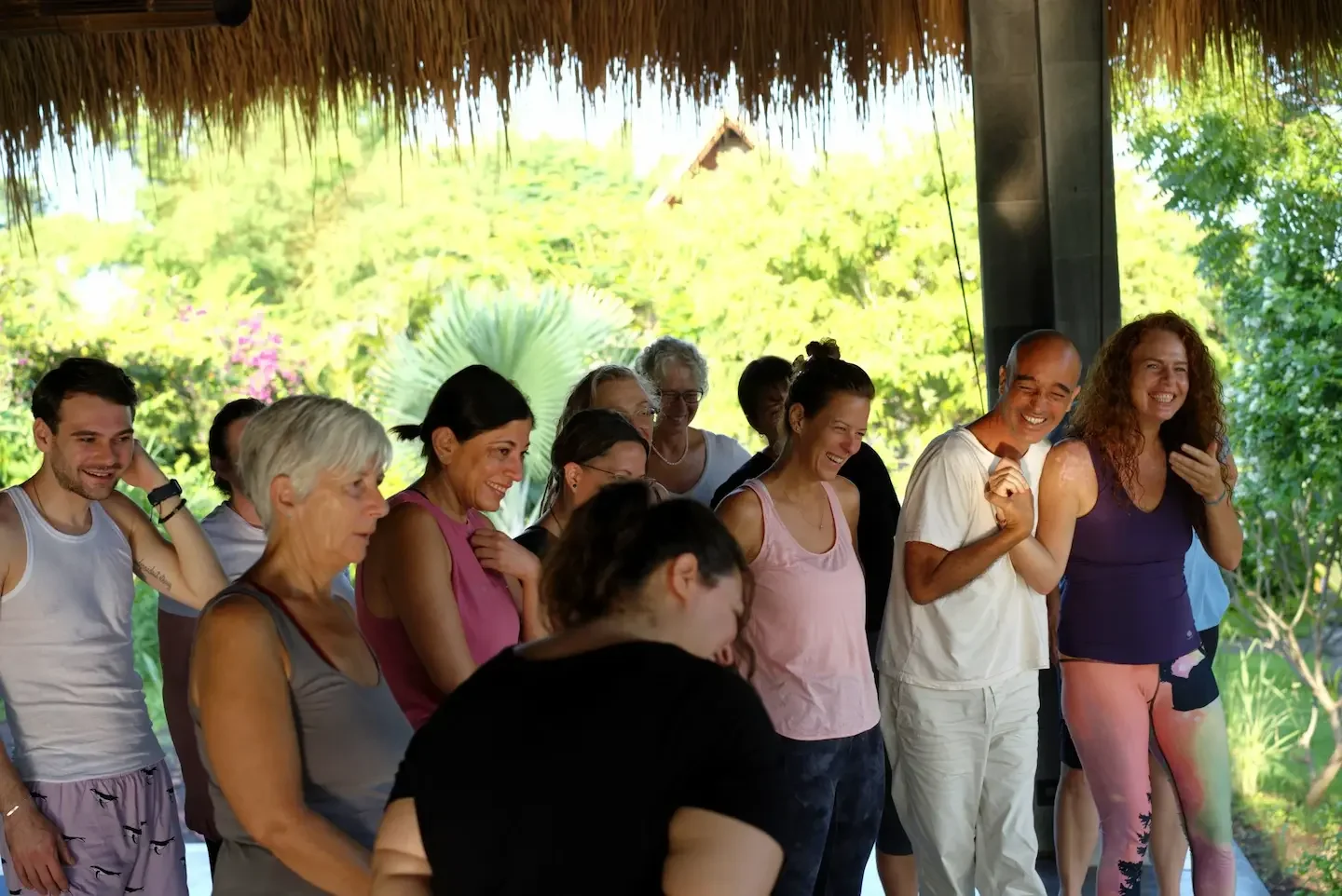 Joyful retreat group laughing and bonding together during the 8-day somatic healing retreat in Ubud, Bali