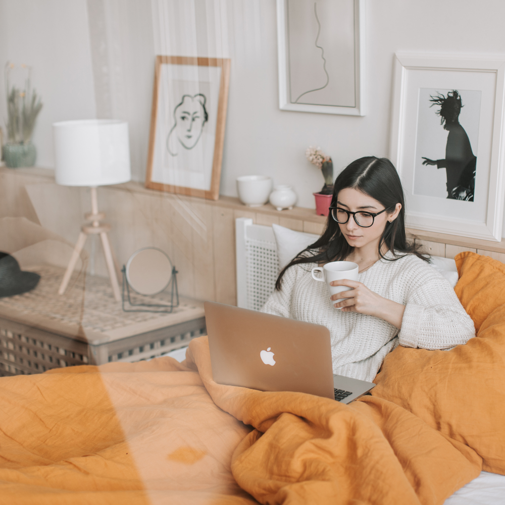 Creative consultant working on brand strategy and design from a home workspace.