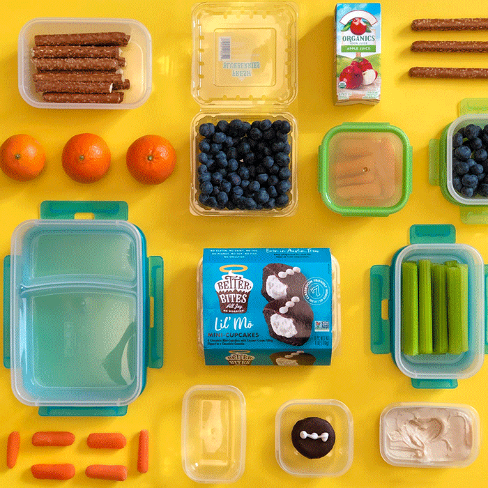 GIF of Better Bites cupcake in a container surrounded but other tupperware and schooltime snacks.