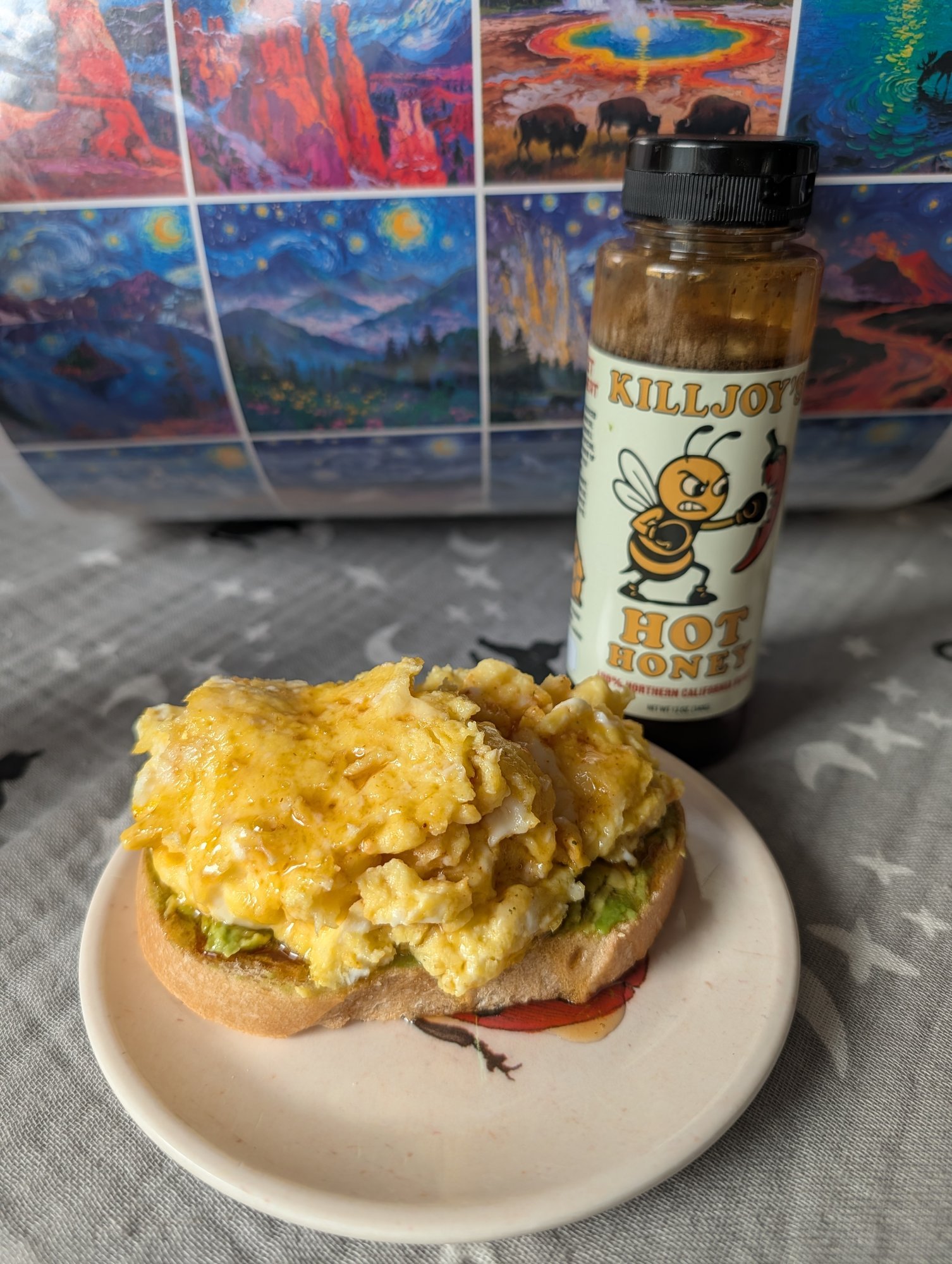 Scrambled egg and avocado toast drizzled with Killjoy's Hot Honey