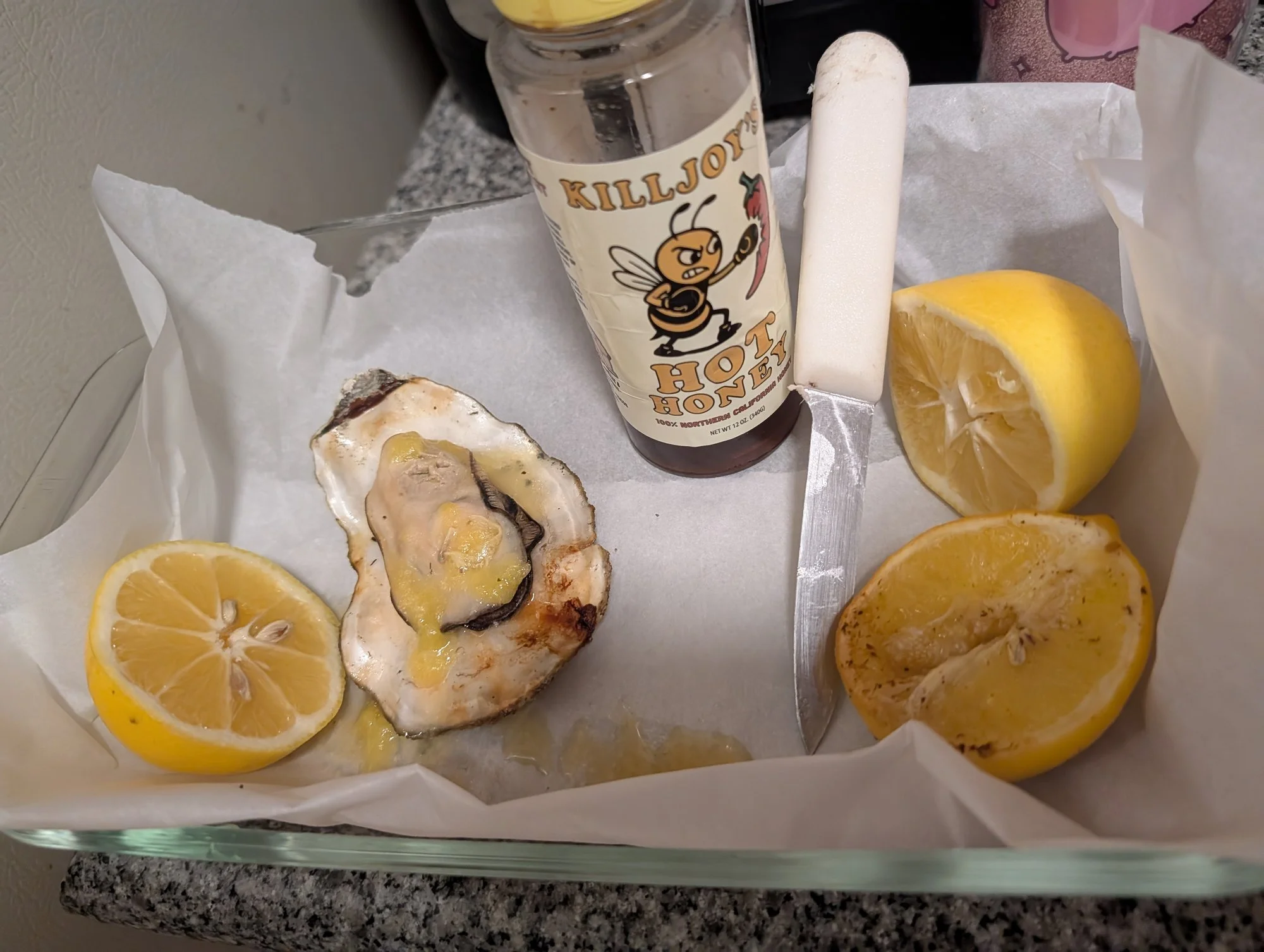 Grilled oysters with lemon and Killjoy's Hot Honey butter