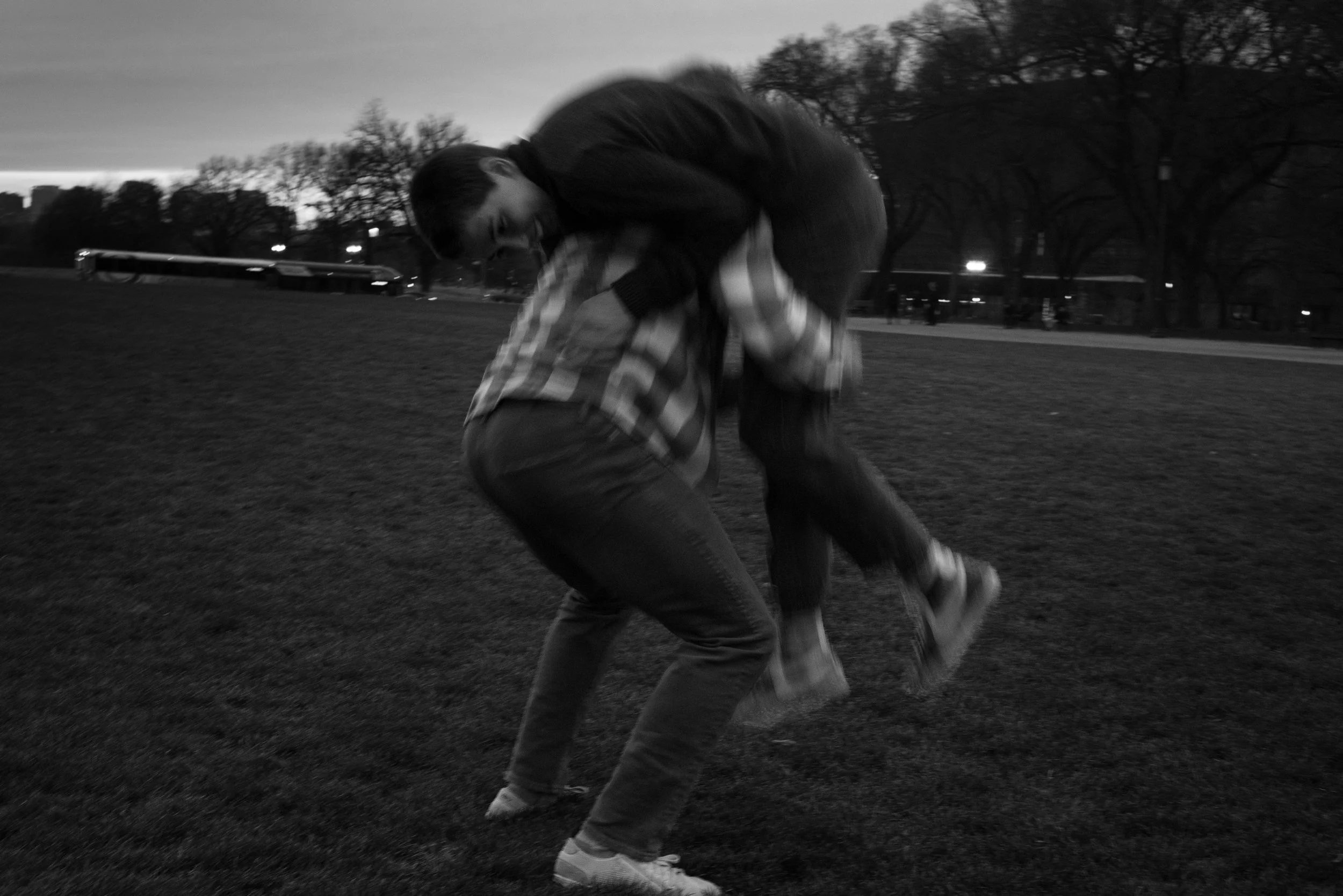 A couple sharing a laugh as a boyfriend picks up his girlfriend