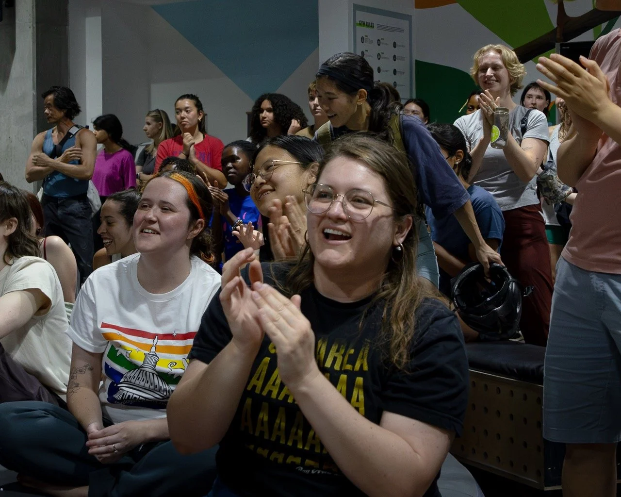 A crowd applauds and smiles during a pride event in Washington DC 