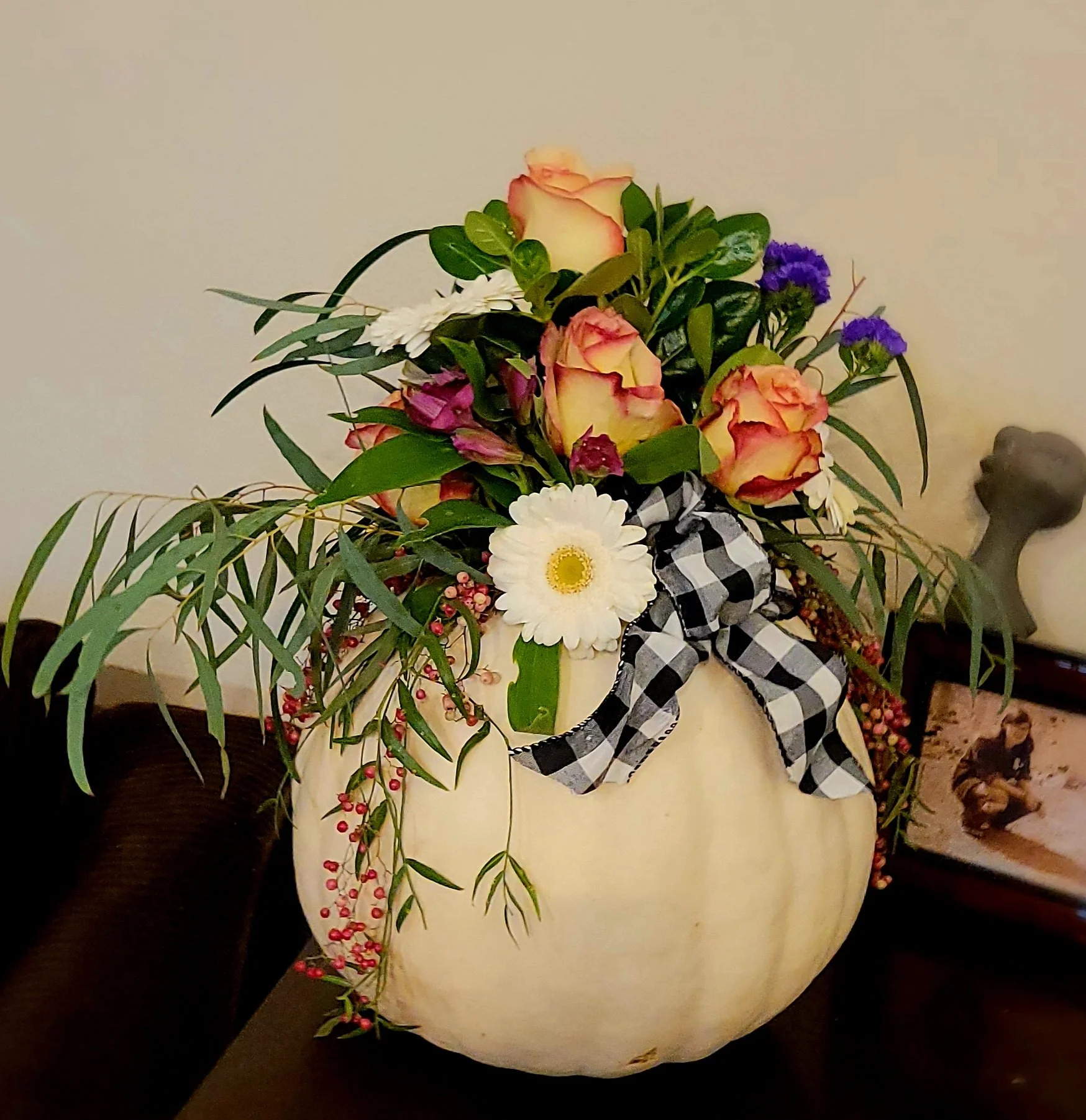 Full size ghost white pumpkin with fresh cut flowers