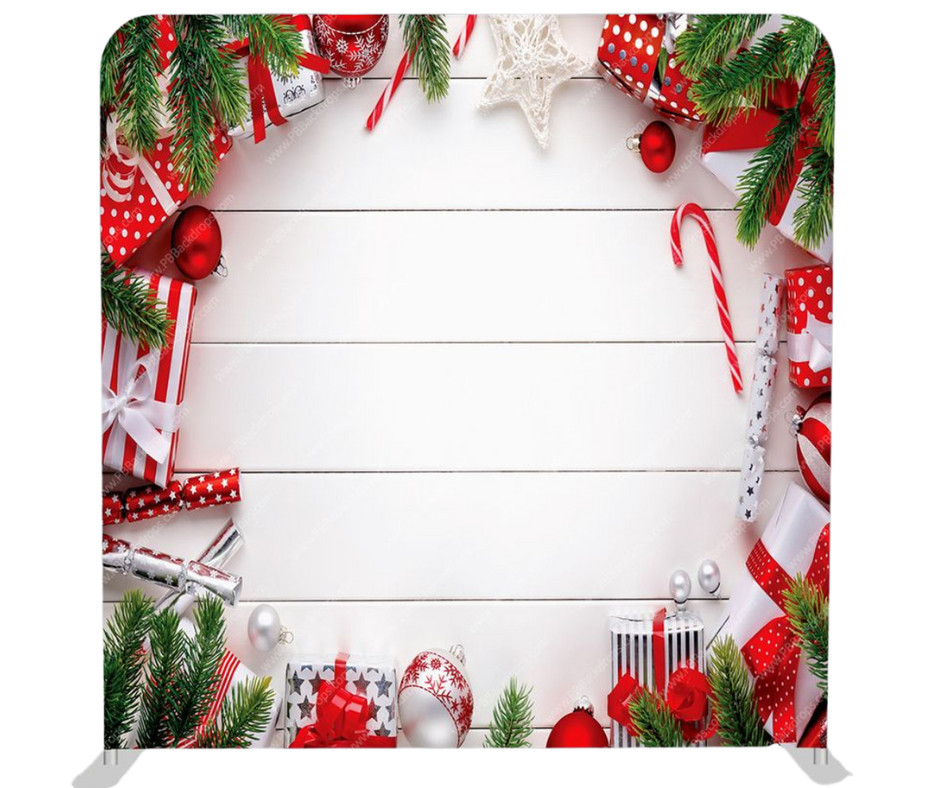 Bright red and white Christmas holiday photo booth backdrop with gifts candy canes and pine branches for rental in Tri-Cities WA by Luna Event Rentals
