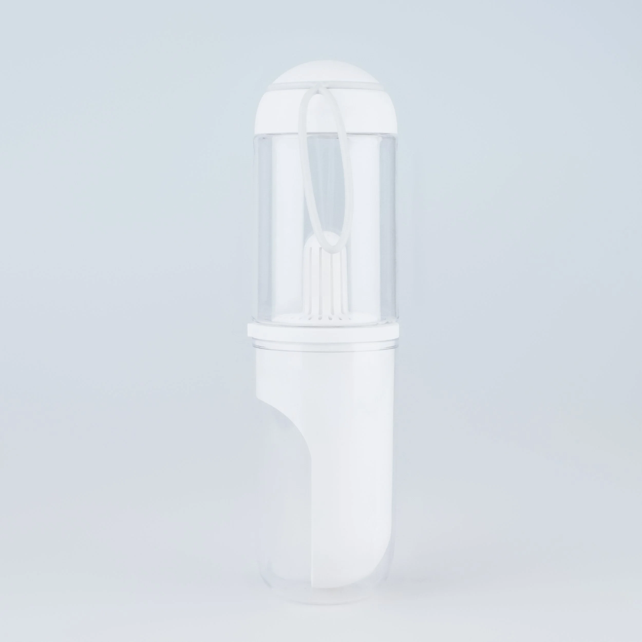 A white and transparent portable humidifier with a water tank and mist outlet.