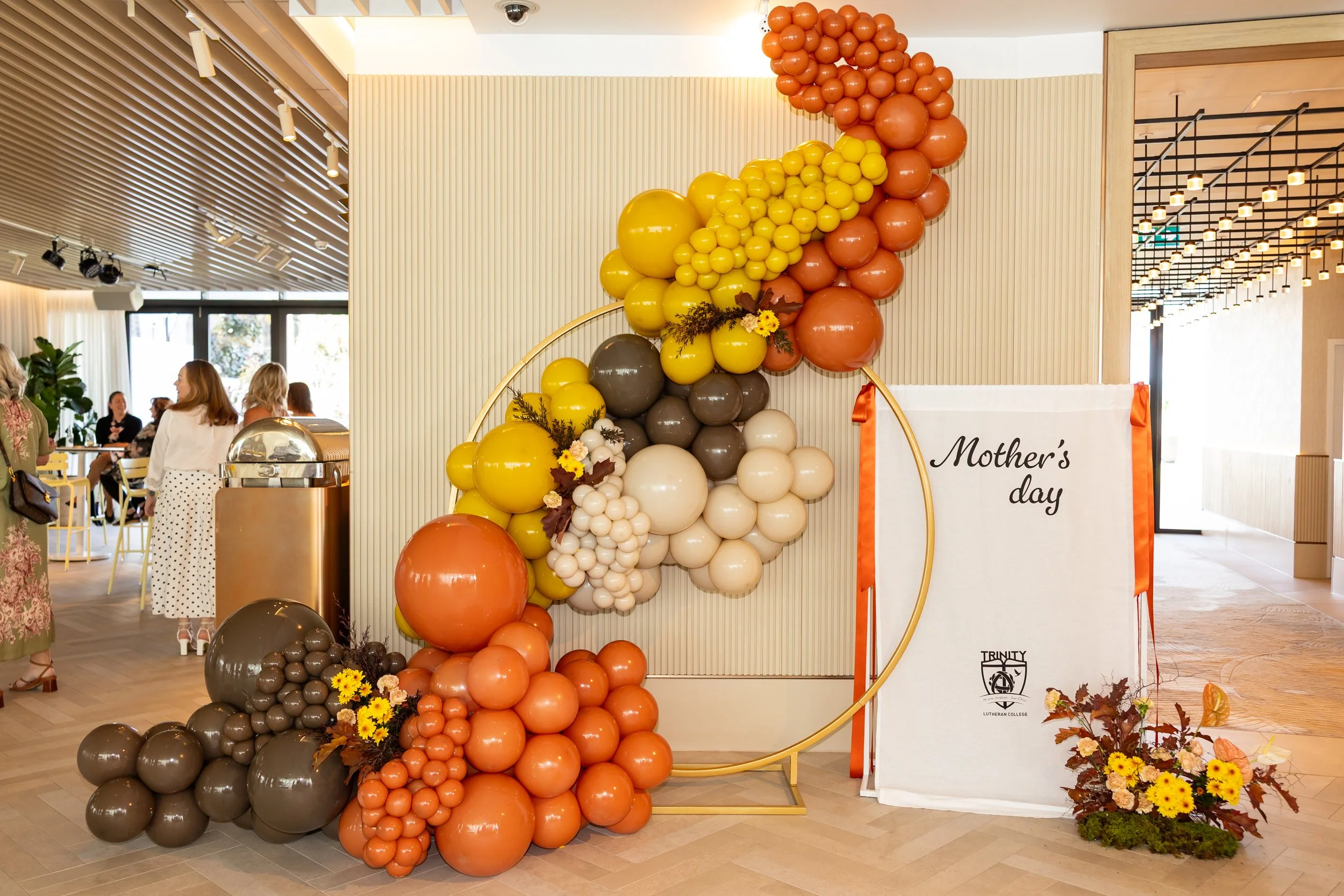 The Star Event autumn florals and balloon garland with custom signage