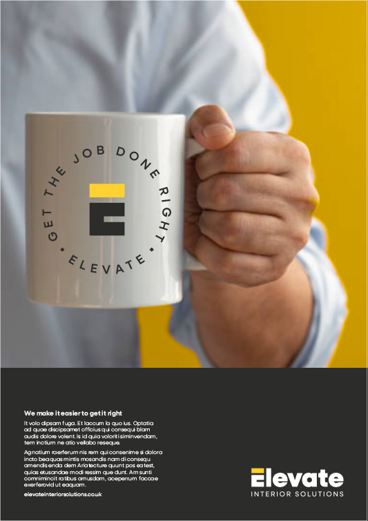 A person holding a white coffee mug with the logo and slogan for 'Elevate Interior Solutions,' featuring a circular arrangement of text and a stylized 'E' symbol, with a yellow and gray color theme. In the background, there's a yellow wall and the person's hand and part of their white shirt are visible.