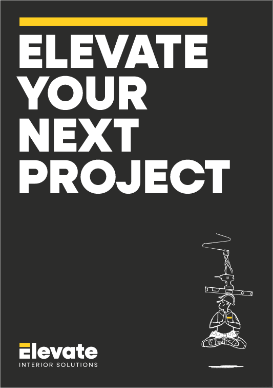 Poster with bold white text on a black background reading 'ELEVATE YOUR NEXT PROJECT'. Small logo at the bottom left says 'elevate INTERIOR SOLUTIONS'. Illustration of a person in a construction helmet balancing a structure on their head is on the right side.