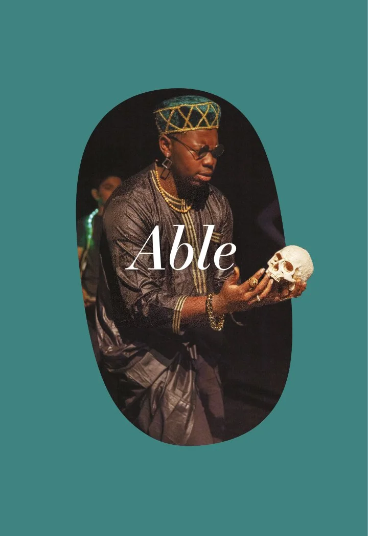 A person dressed in traditional African attire holding a skull, with the word "Able" overlaid.