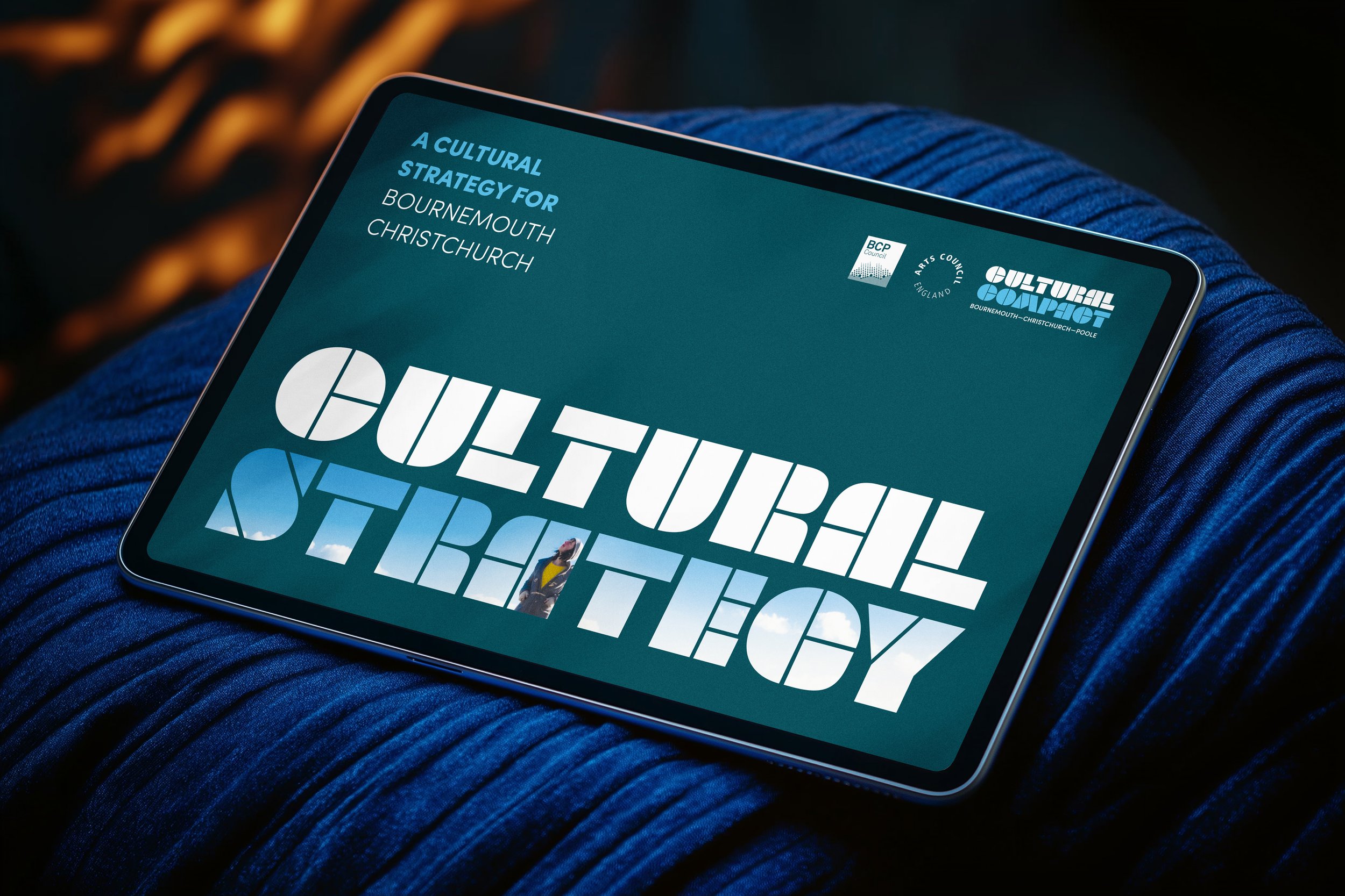 Tablet screen displaying a cultural strategy document for Bournemouth Christchurch, with large text 'CULTURAL STRATEGY' and logos for BCP and Cultural Compact