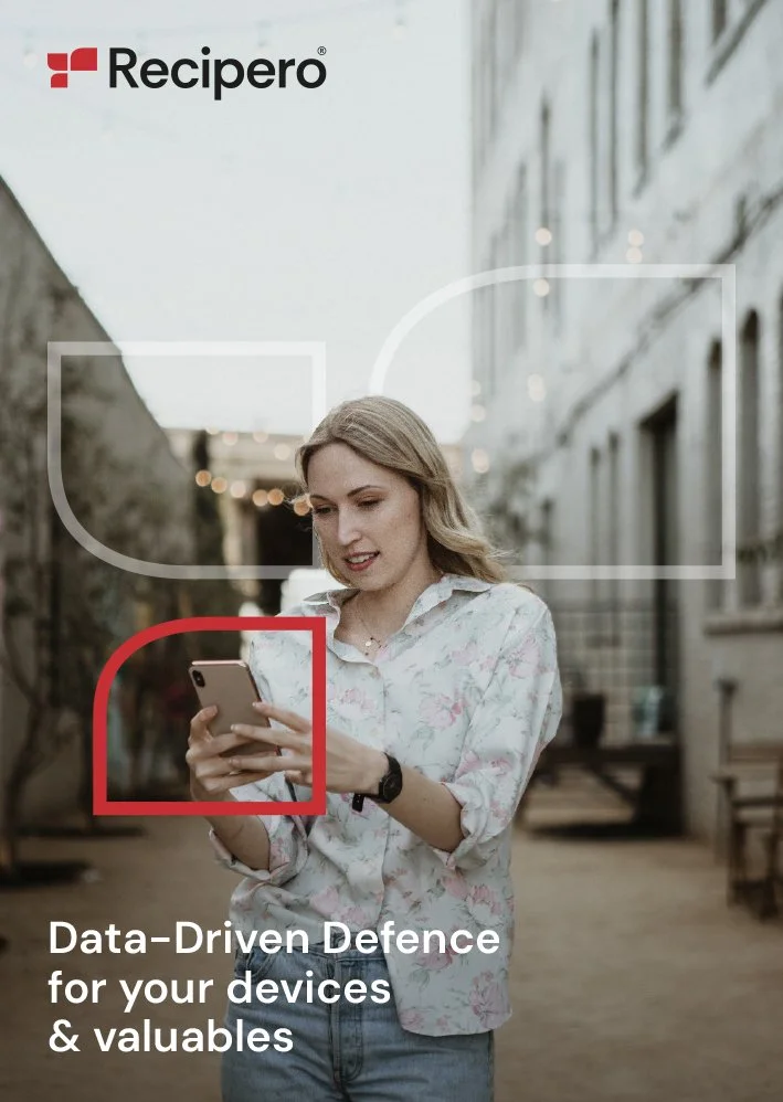 A young woman in a floral shirt looking at her phone outside in an alleyway with buildings on either side, with Recipero branding and the text 'Data-Driven Defence for your devices & valuables.'