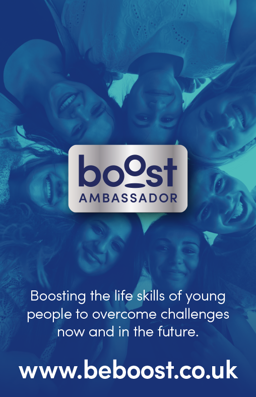 A group of diverse young people smiling and looking up at the camera, with a logo for 'boost AMBASSADOR' and the text 'Boosting the life skills of young people to overcome challenges now and in the future.' followed by a website URL www.beboost.co.uk.