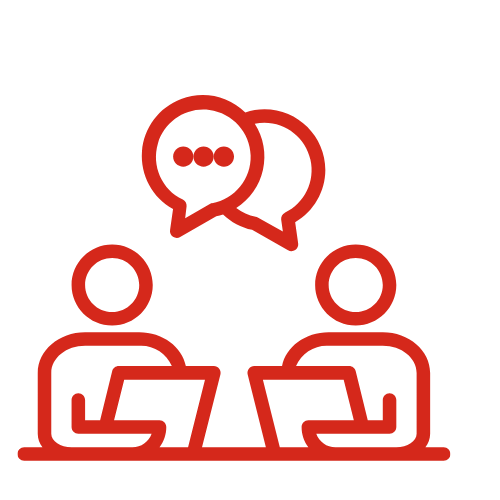 Two people sitting at a table having a conversation with speech bubbles above their heads.