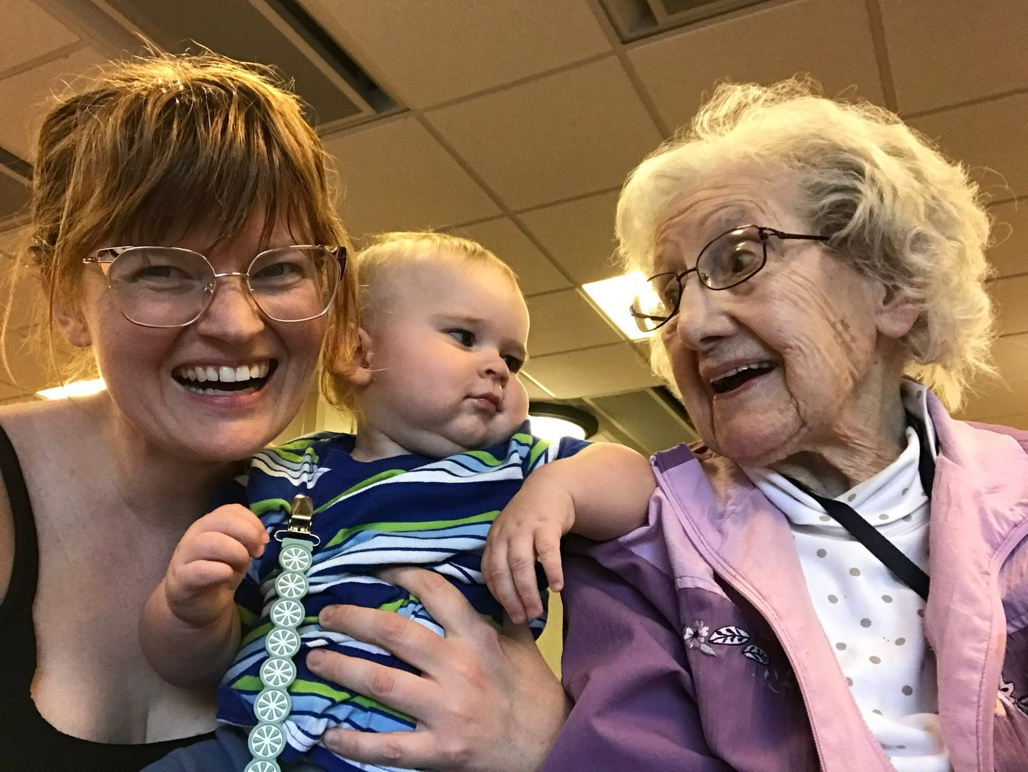 Clarice sharing a joyful moment with two younger generations
