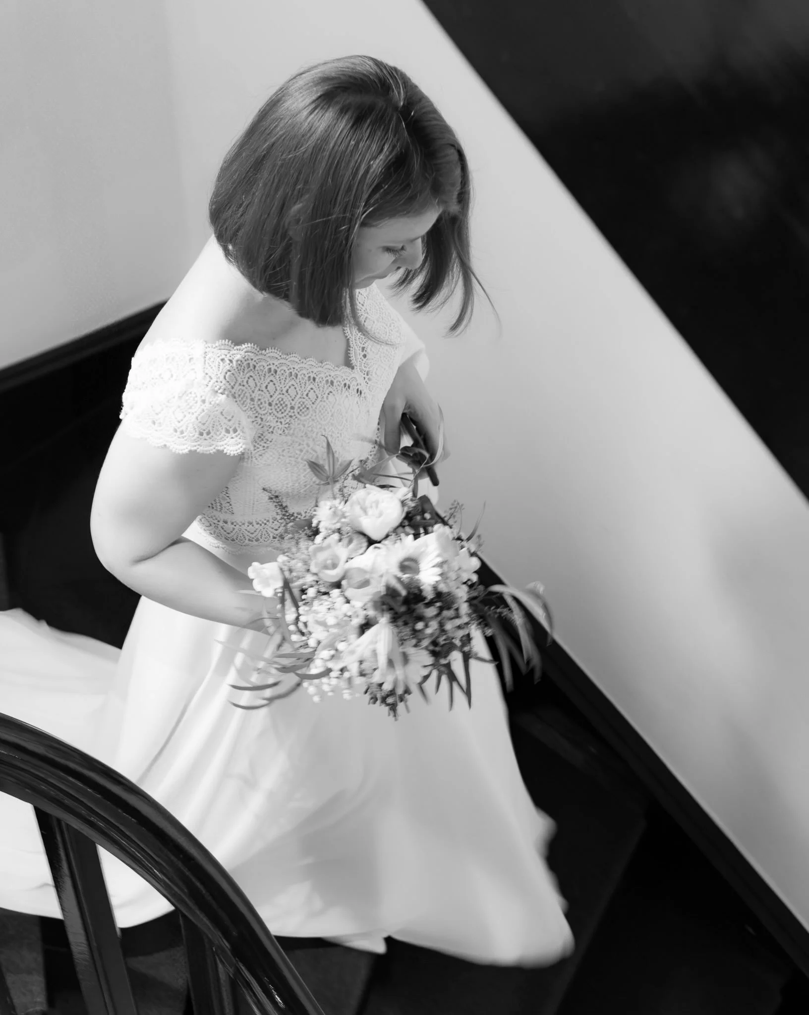 Teresa &amp; Frederik said yes in 2024. And still, this in-between moment of Teresa walking down from her room to the lobby, in joyful anticipation of welcoming her parents, is one of my all-time favorite bride photos.
