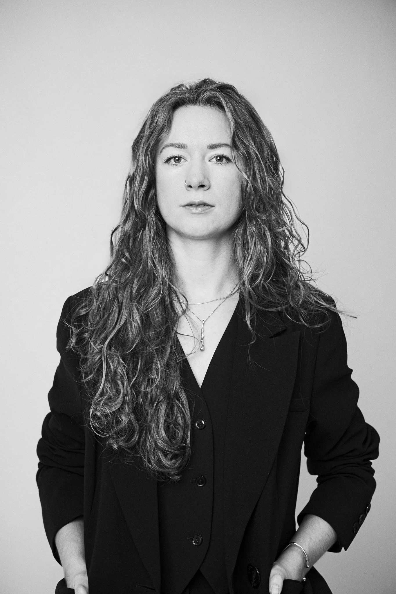 Editorial portrait of Jessica Maurer, luxury wedding photographer at work.