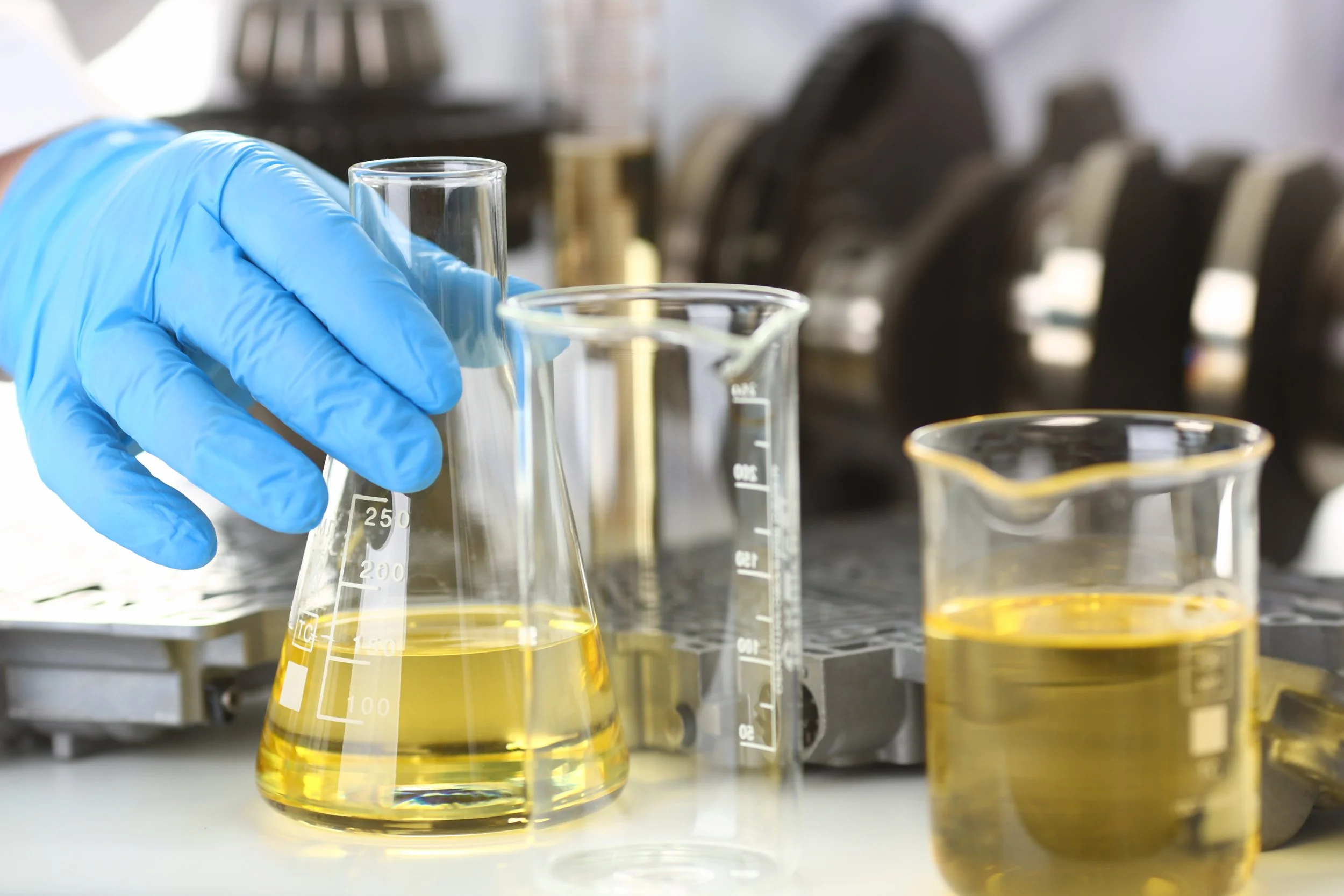 male-hands-protective-gloves-hold-test-tube.jpg