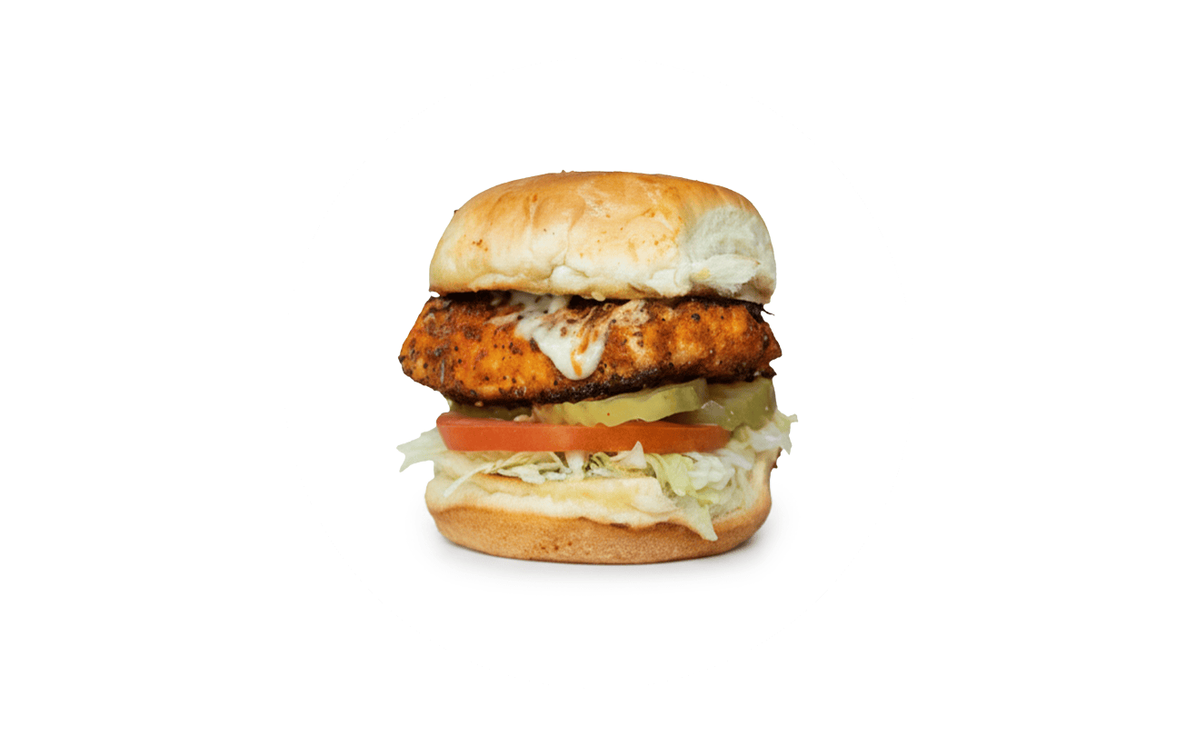 Slip Sliders Captain Jack sandwich featuring grilled or blackened salmon with lettuce, tomato, pickles, and tartar sauce.