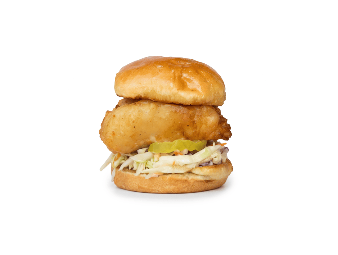 Slip Sliders British Chippy sandwich featuring lightly fried whitefish, Slip Slaw, pickles, and tartar sauce.