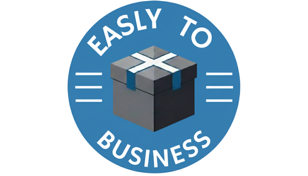 A puck-shaped logo with the words "EASY TO BUSINESS" around the top and bottom edges. In the center, there is a 3D illustration of a gray and black gift box with a white cross on the lid and blue ribbon straps.