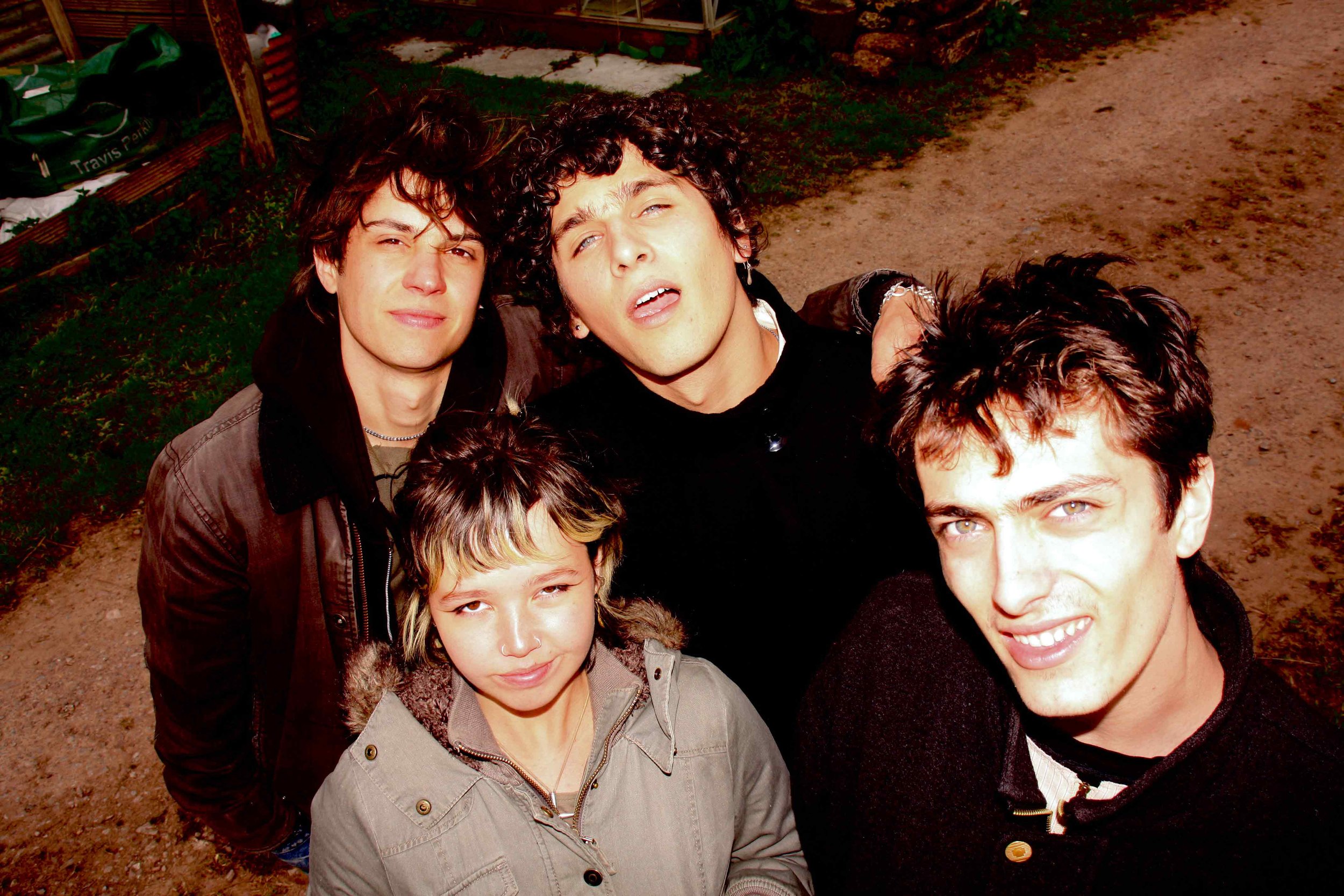 Four members of the band MORN look up at the camera