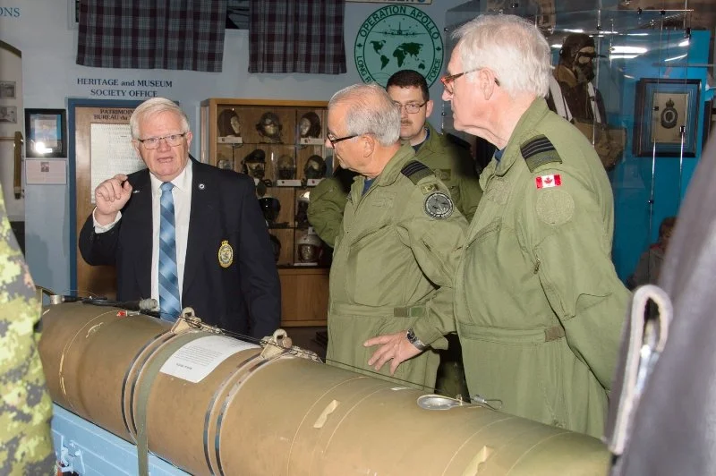  Former 405 (Long Range Patrol) Squadron Honorary Colonel Bert Campbell, and Greenwood Military Aviation Museum volunteer, conducts a tour of the museum with visiting Royal Canadian Air Force Honorary Colonels June 8. Corporal K. Neate, 14 Wing Imagi